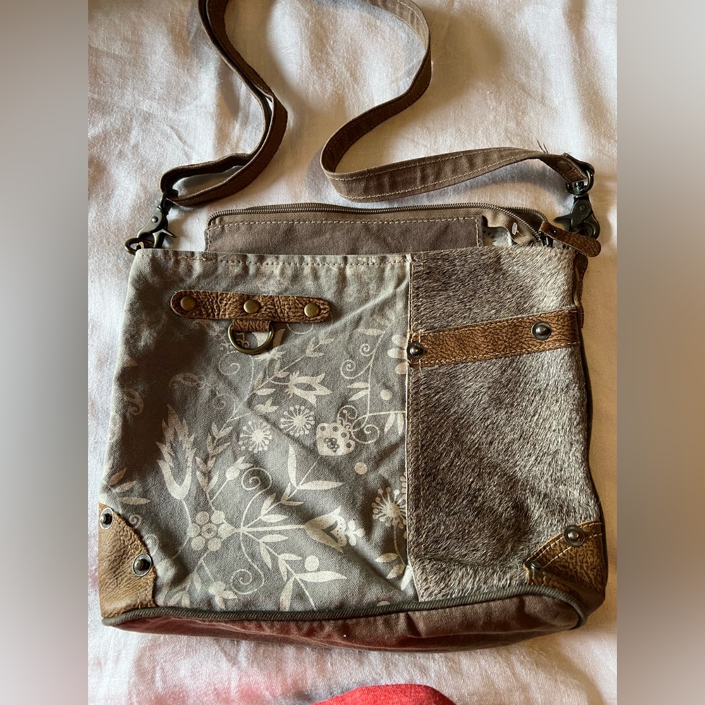 Myra Bag with Mixed Materials. Crossbody. Cow hide mixed with a floral design.